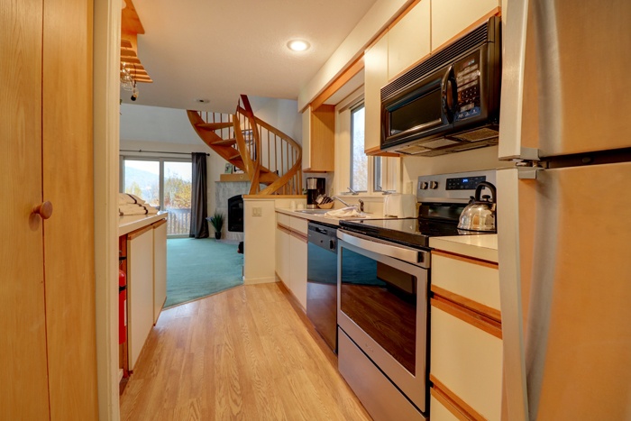 kitchen area oven microwave two bedroom townhouse