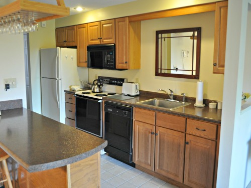 nordic village one bedroom condo near pool kitchen area