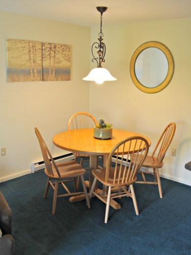 nordic village one bedroom condo near pool dining table