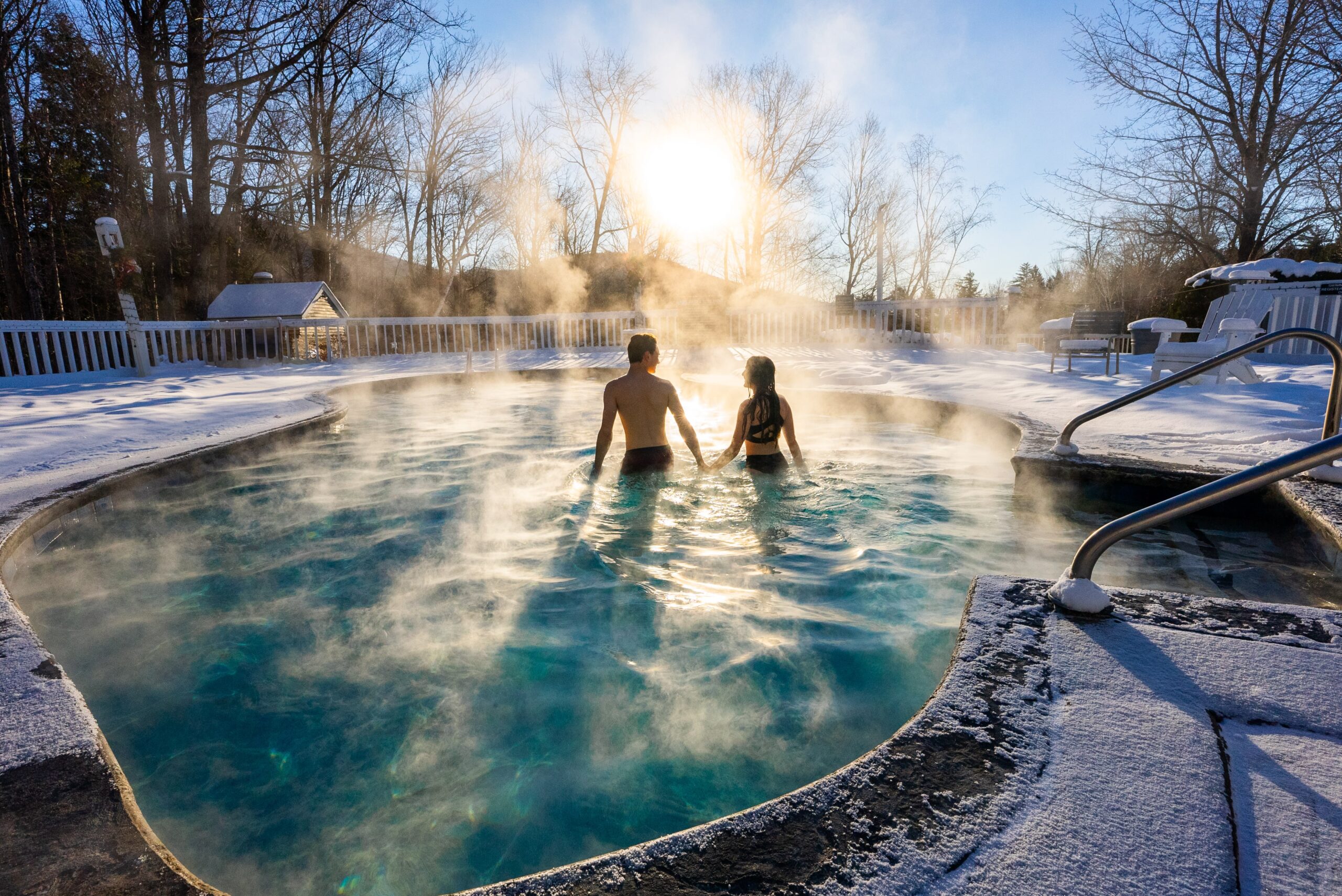 Nordic Village Resort Couple in Outdoor Pool Winter